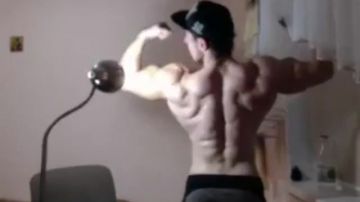 Strong guy in a cap on webcam