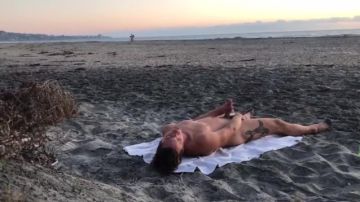 Man masturbates on the beach