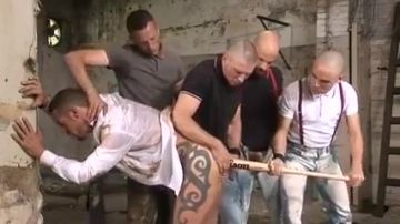 Tattooed hunk dominated in gangbang